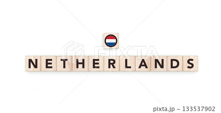 Wooden blocks bearing the name and flag of Netherlands. Dutch and European Culture, national identity, travel, and geography in a copy space design. 133537902