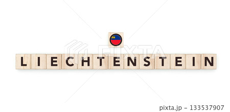 Wooden blocks bearing the name and flag of Liechtenstein. Liechtensteiner and European Culture, national identity, travel, and geography in a copy space design. 133537907