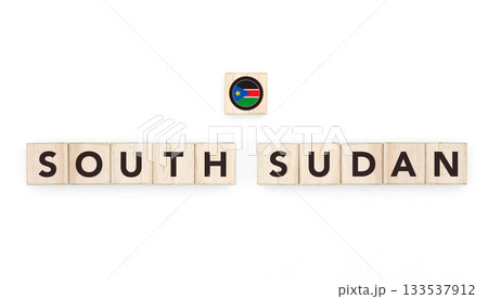 Wooden blocks bearing the name and flag of South Sudan. South Sudanese and African Culture, national identity, travel, and geography in a copy space design. 133537912