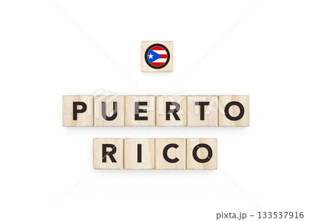 Wooden blocks bearing the name and flag of Puerto Rico. Puerto Rican and Caribbean Culture, national identity, travel, and geography in a copy space design. 133537916