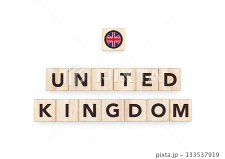 Wooden blocks bearing the name and flag of United Kingdom. British and European Culture, national identity, travel, and geography in a copy space design. 133537919