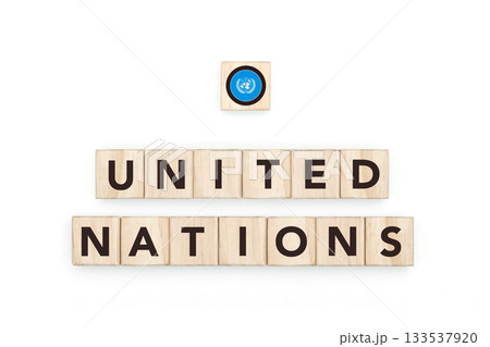 Wooden blocks bearing the name and flag of United Nations. Global Culture, world identity, travel, and geography in a copy space design. Wooden blocks bearing the name and flag of United Nations. Global Culture, world identity, travel, and geography in a copy space design. 133537920