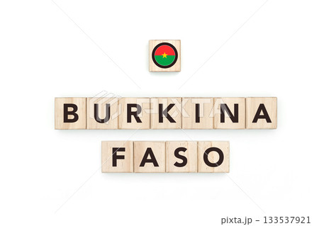 Wooden blocks bearing the name and flag of Burkina Faso. Burkinabe and African Culture, national identity, travel, and geography in a copy space design. Wooden blocks bearing the name and flag of Burkina Faso. Burkinabe and African Culture, national identity, travel, and geography in a copy space design. 133537921
