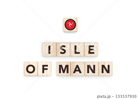 Wooden blocks bearing the name and flag of Isle Of Mann. Manx and British Culture, national identity, travel, and geography in a copy space design. 133537930