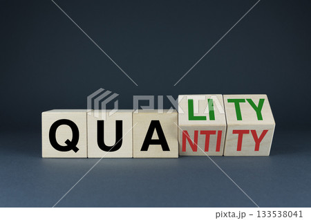 Quality or Quantity. The cubes form the choice words Quality or Quantity. 133538041