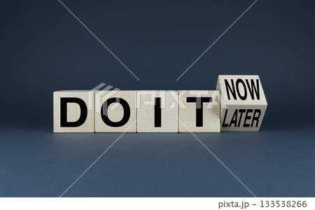 Do it now or later. Cubes form words Do it now or Do it later. Do it now or later. Cubes form words Do it now or Do it later. 133538266
