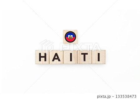 Wooden blocks bearing the name and flag of Haiti. Haitian and Caribbean Culture, national identity, travel, and geography in a copy space design. 133538473