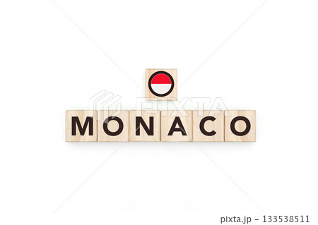 Wooden blocks bearing the name and flag of Monaco. Monegasque and Mediterranean Culture, national identity, travel, and geography in a copy space design. Wooden blocks bearing the name and flag of Monaco. Monegasque and Mediterranean Culture, national identity, travel, and geography in a copy space design. 133538511