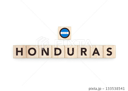 Wooden blocks bearing the name and flag of Honduras. Honduran and Caribbean Culture, national identity, travel, and geography in a copy space design. 133538541