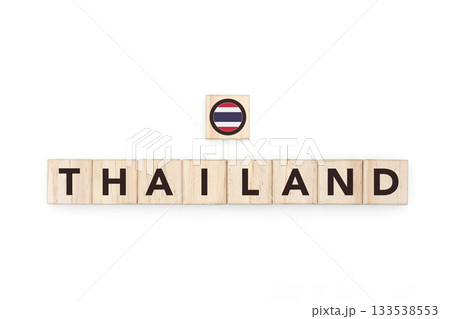 Wooden blocks bearing the name and flag of Thailand. Thai and Southeast Asian Culture, national identity, travel, and geography in a copy space design. 133538553