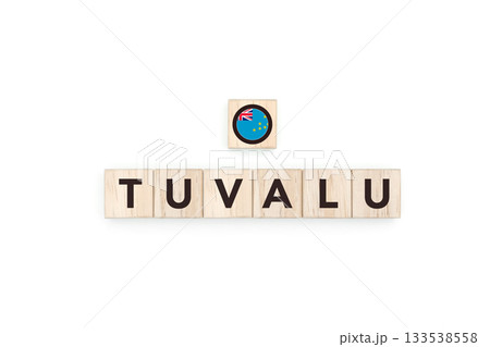 Wooden blocks bearing the name and flag of Tuvalu. Tuvaluan and Micronesia Culture, national identity, travel, and geography in a copy space design. 133538558