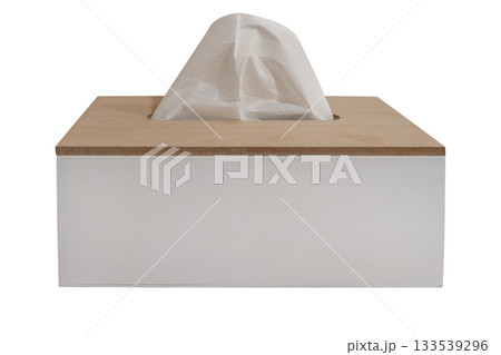 Minimalistic wooden tissue box with a white paper tissue sticking out isolated on white background. Clipping path Minimalistic wooden tissue box with a white paper tissue sticking out isolated on white background. Clipping path 133539296