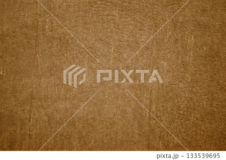Brown textured wall background with abstract plaster pattern and rough brown putty Brown textured wall background with abstract plaster pattern and rough brown putty 133539695