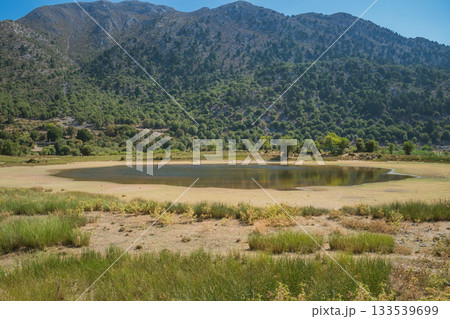 Climate change issue, lake drying in Omalos village in Crete White mountains. Climate change issue, lake drying in Omalos village in Crete White mountains. 133539699