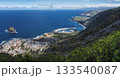 Panorama of Garachico from Mirador de Garachico. Colorful houses and harbor. Ocean with lava rock pools and island. Popular tourist destination, Tenerife Canary Islands. Aerial wide postcard 133540087