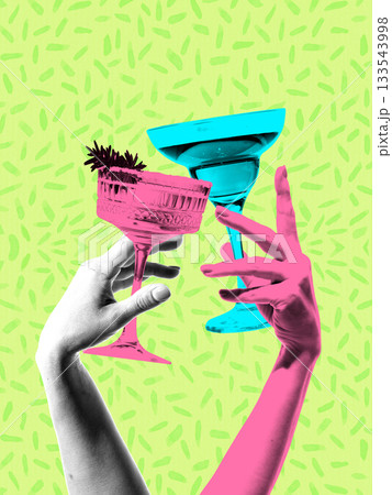 Playful composition with hands raising colorful cocktail glasses. 133543998