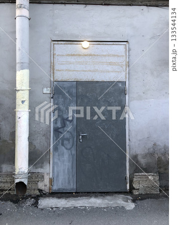 An iron front door and drainpipe An iron front door and drainpipe 133544134
