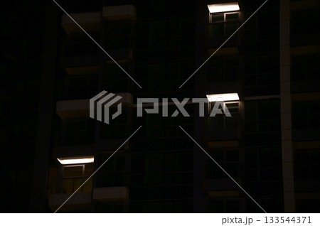 Close-up of the lamp at the residential housing. Lighting at night. Cityscape. 133544371