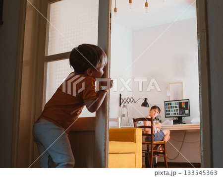 Two Brothers Interacting at Home in Casual Setting Two Brothers Interacting at Home in Casual Setting 133545363