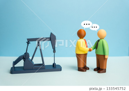Businessmen negotiate oil production and energy resource sales. Purchase and sale of mineral deposits. Services technological assistance in mineral resource development. Geopolitical energy relations Businessmen negotiate oil production and energy resource sales. Purchase and sale of mineral deposits. Services technological assistance in mineral resource development. Geopolitical energy relations 133545752