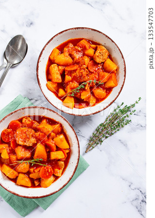 meat goulash with potatoes and carrots, sweet peppers, in a saucepan, top view, traditional Hungarian soup, homemade, no people, 133547703