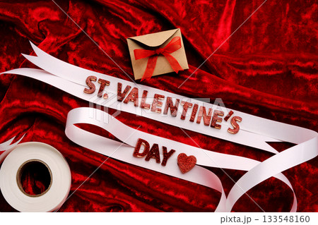 Festive background with the words St. Valentine's Day with red velvet and white ribbon. Festive background with the words St. Valentine's Day with red velvet and white ribbon. 133548160