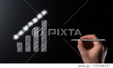 A hand sketches an upward trending bar graph on a dark background using a silver pen, symbolizing progress and improvement A hand sketches an upward trending bar graph on a dark background using a silver pen, symbolizing progress and improvement 133548757