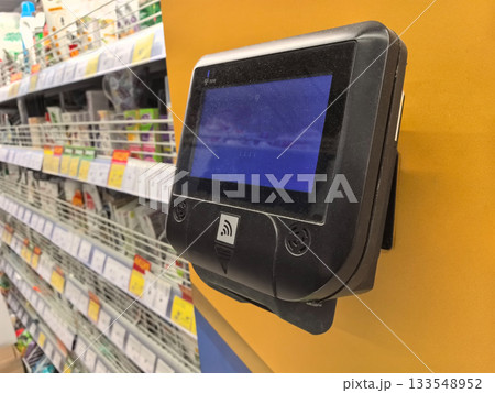 Price checker gadget in retail store for convenient product information Price checker gadget in retail store for convenient product information 133548952