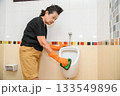 Mom is cleaning the bathroom 133549896