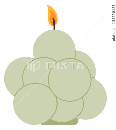 A candle with a yellow flame sits on a white background 133550121