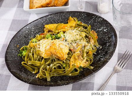 Traditional Italian pasta with meat additive - chicken in cream sauce and broccoli. Traditional Italian pasta with meat additive - chicken in cream sauce and broccoli. 133550918