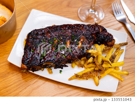 American style fried ribs with potatoes 133551043