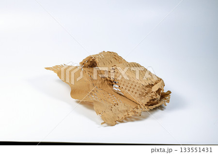 Parcel wrapped in eco-friendly wrapping paper, lightweight bubble wrap for protective packaging, Environmentally friendly Honeycomb paper hexagonal shape made of cardboard recycled craft paper. 133551431