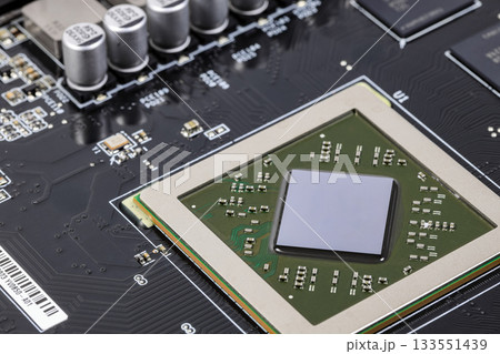 Close up modern printed circuit Board with Advanced Graphic Processing Unit.  Electronic Devices Production. 133551439