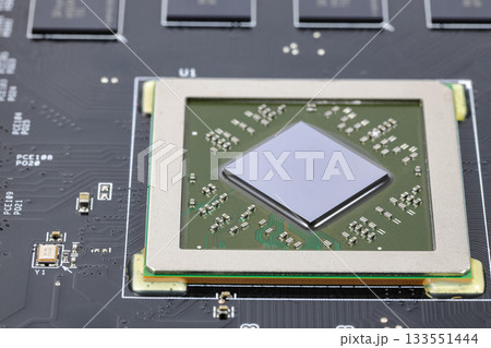Close up modern printed circuit Board with Advanced Graphic Processing Unit.  Electronic Devices Production. 133551444