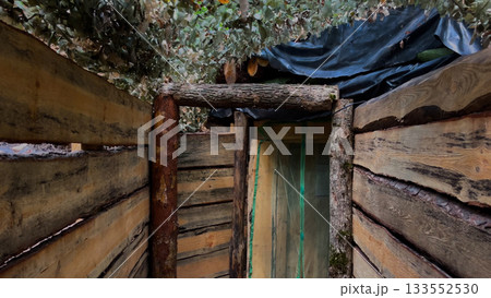 A dugout underground in the forest.  133552530