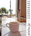Sunny Cafe Table With White Coffee Mug By Window Seat In Bright Morning Light 133554181