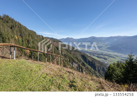 Innsbruck, Austrian wooden path paraglider take off spot from the top of Alps in Austria Innsbruck, Austrian wooden path paraglider take off spot from the top of Alps in Austria 133554258