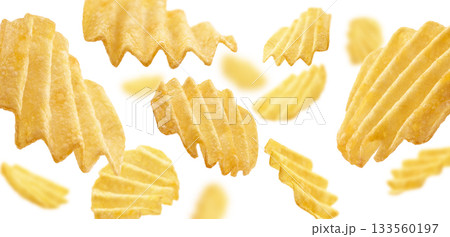 Fluted potato chips levitate on a white background 133560197