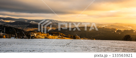 Panoramic view of winter mountain landscape in the evening. Paseky nad Jizerou, Giant Mountains, Czech Republuc Panoramic view of winter mountain landscape in the evening. Paseky nad Jizerou, Giant Mountains, Czech Republuc 133563921