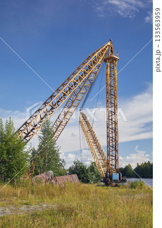 Cargo crane on the river bank 133563959