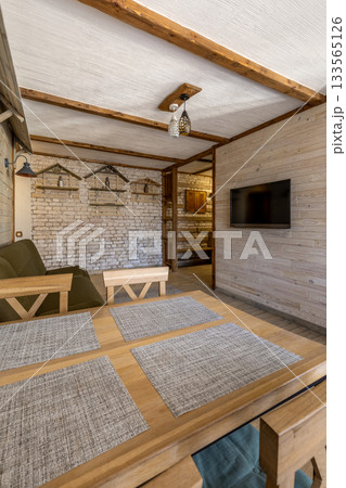 Rustic Living Room with Brick Wall and Wooden Furniture Rustic Living Room with Brick Wall and Wooden Furniture 133565126