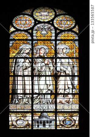 Saint Genevieve, stained glass window in the Saint Augustine church in Paris, France Saint Genevieve, stained glass window in the Saint Augustine church in Paris, France 133565587