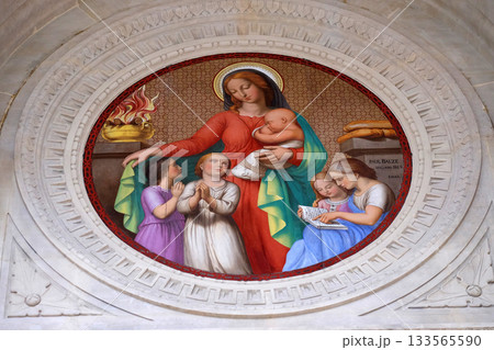 Medallion of the portal represents Charity, Saint Augustine church in Paris, France Medallion of the portal represents Charity, Saint Augustine church in Paris, France 133565590