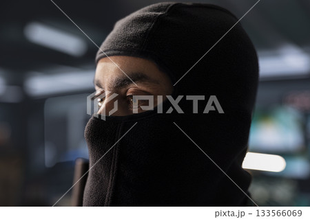 Espionage specialist in control room uses military tech to identify threats during armed conflict. Masked intelligence agent uses software to relay info to generals on war front line Espionage specialist in control room uses military tech to identify threats during armed conflict. Masked intelligence agent uses software to relay info to generals on war front line 133566069
