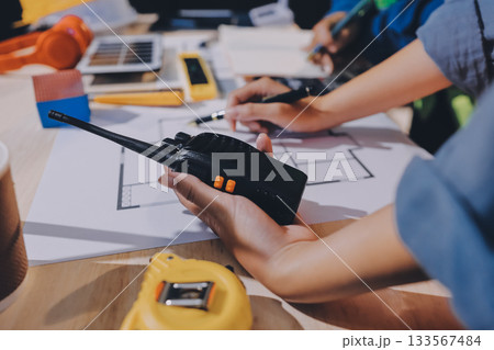 Architects and engineers working collaboratively on construction project 133567484