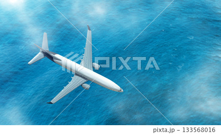 Aerial view of an airplane flying over the clouds with blue ocean. Concept of travel Aerial view of an airplane flying over the clouds with blue ocean. Concept of travel 133568016