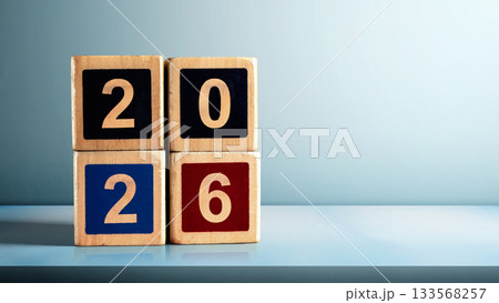 Stack of wooden cubes with the number 2026 on the table with a colored background. Happy New Year concept or Celebration Stack of wooden cubes with the number 2026 on the table with a colored background. Happy New Year concept or Celebration 133568257
