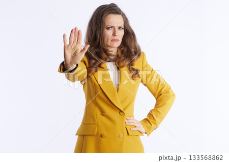 Assertive Businesswoman Giving a Stop Hand Gesture 133568862