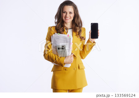 Tech-Savvy Businesswoman with Documents and Smartphone 133569124